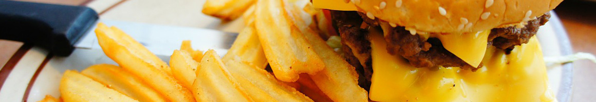 Eating American (Traditional) Burger at Burger Lounge restaurant in Carlsbad, CA.